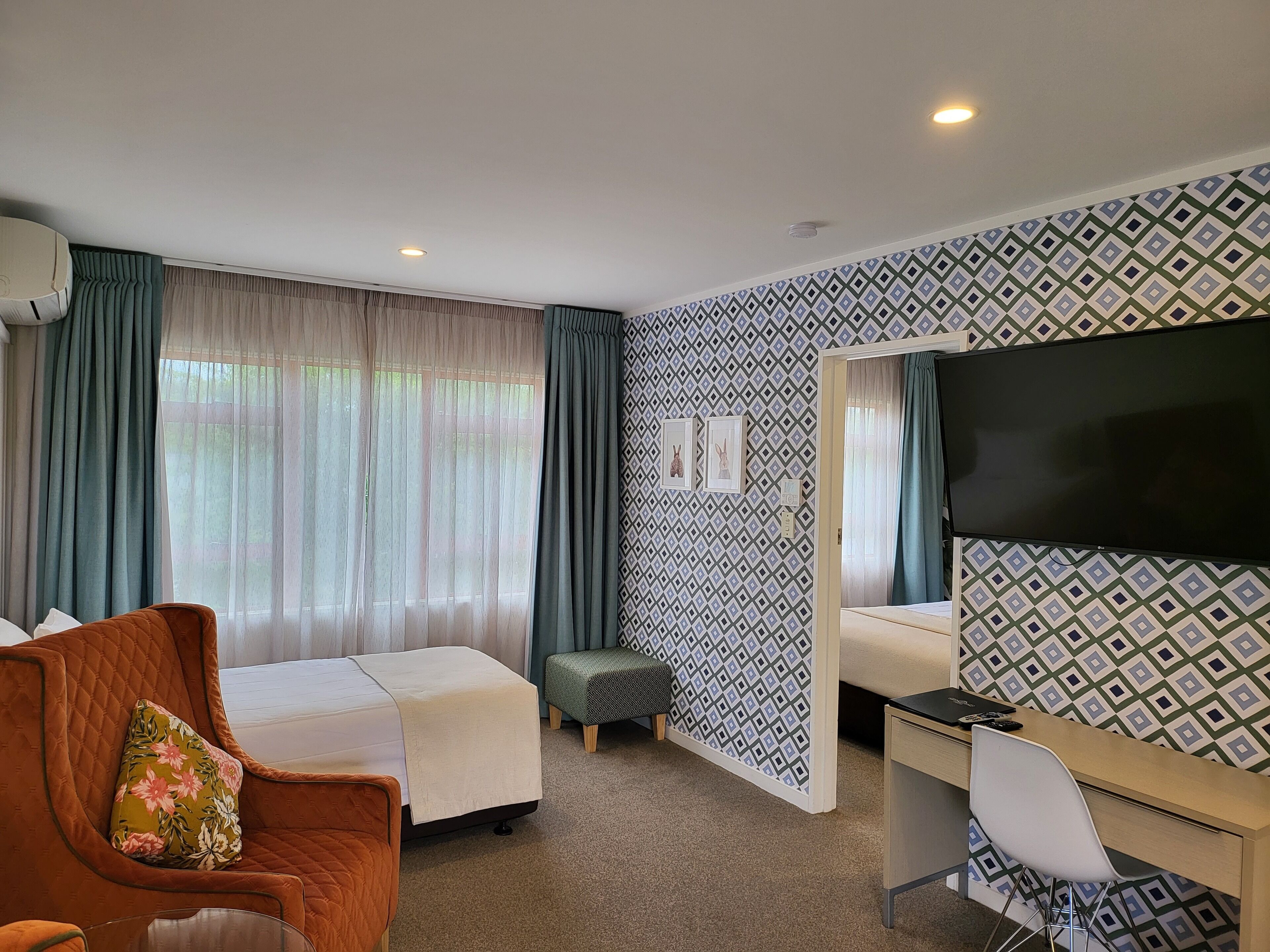 Premium One Bedroom | Living area | 50-inch flat-screen TV with cable channels, TV, Netflix