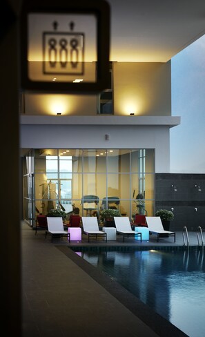 Relax by the pool surrounded by lounge chairs and enjoy the hotel's contemporary design.