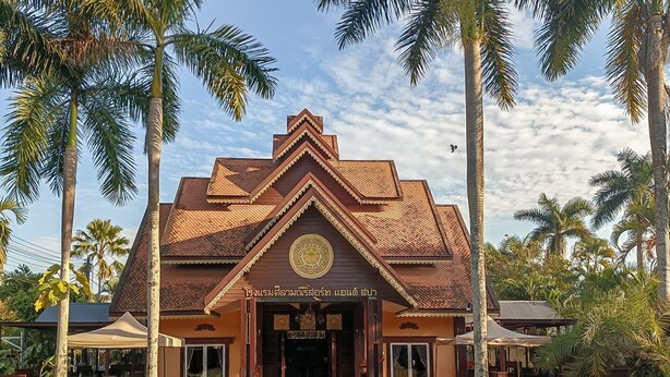 A traditional wooden building with a triangular roof and a central emblem. - Silamanee Resort and Spa Hotel (Mae Sai)