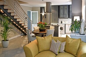 Deluxe Apartment, 2 Bedrooms, Non Smoking | Living area | 43-inch flat-screen TV with satellite channels, Netflix