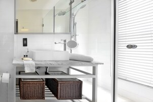 Separate bathtub and shower, deep-soaking bathtub, designer toiletries