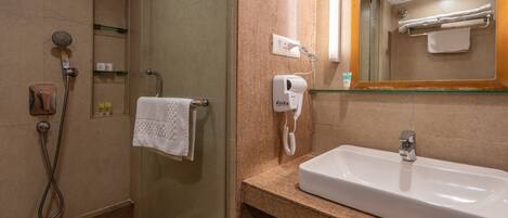 A bathroom with a shower, a sink, a towel rack, and a mirror.