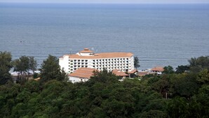 A large white building with multiple balconies overlooking the sea. - BP Samila Beach Hotel & Resort (Songkhla)