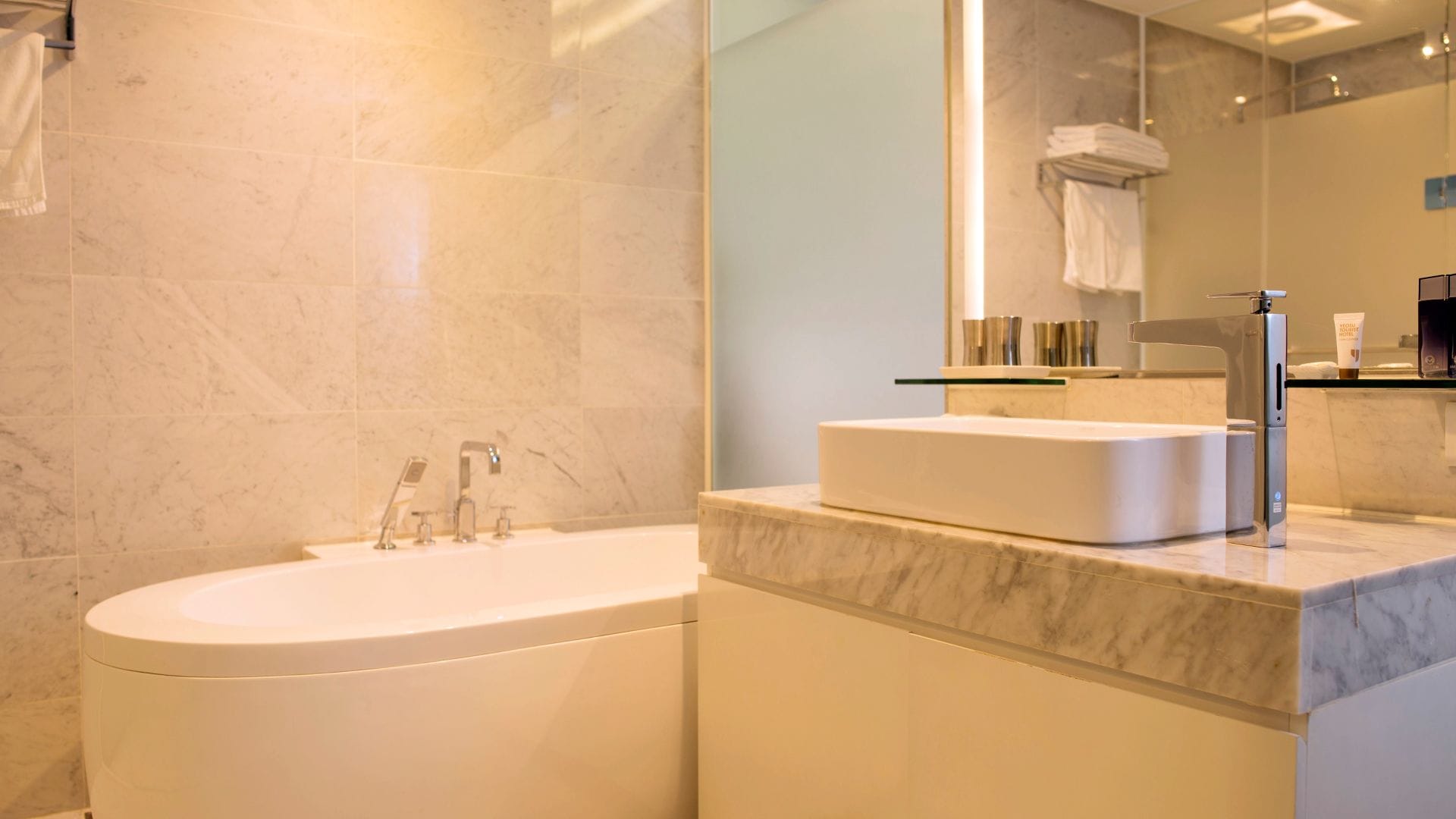 deluxe twin room | bathroom | hair dryer, bathrobes, bidet, towels