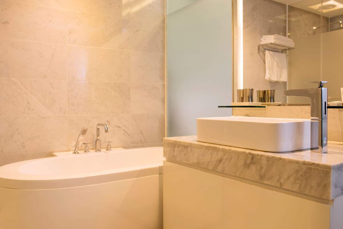 deluxe twin room | bathroom | hair dryer, bathrobes, bidet, towels