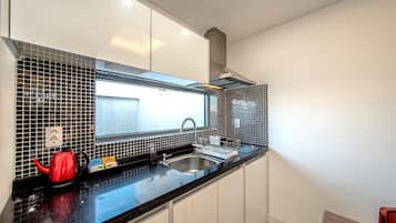 Fridge, microwave, stovetop, coffee/tea maker