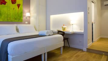 Triple Room | Minibar, in-room safe, desk, soundproofing