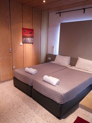 Standard Apartment, 2 Bedrooms, Balcony, Sea View | 1 bedroom, in-room safe, desk, iron/ironing board