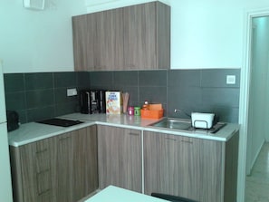 Standard Apartment, 2 Bedrooms, Balcony, Sea View | Private kitchenette | Fridge, microwave, stovetop, coffee/tea maker