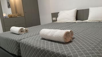 Apartment, 2 Twin Beds, Sea View | 1 bedroom, in-room safe, desk, iron/ironing board