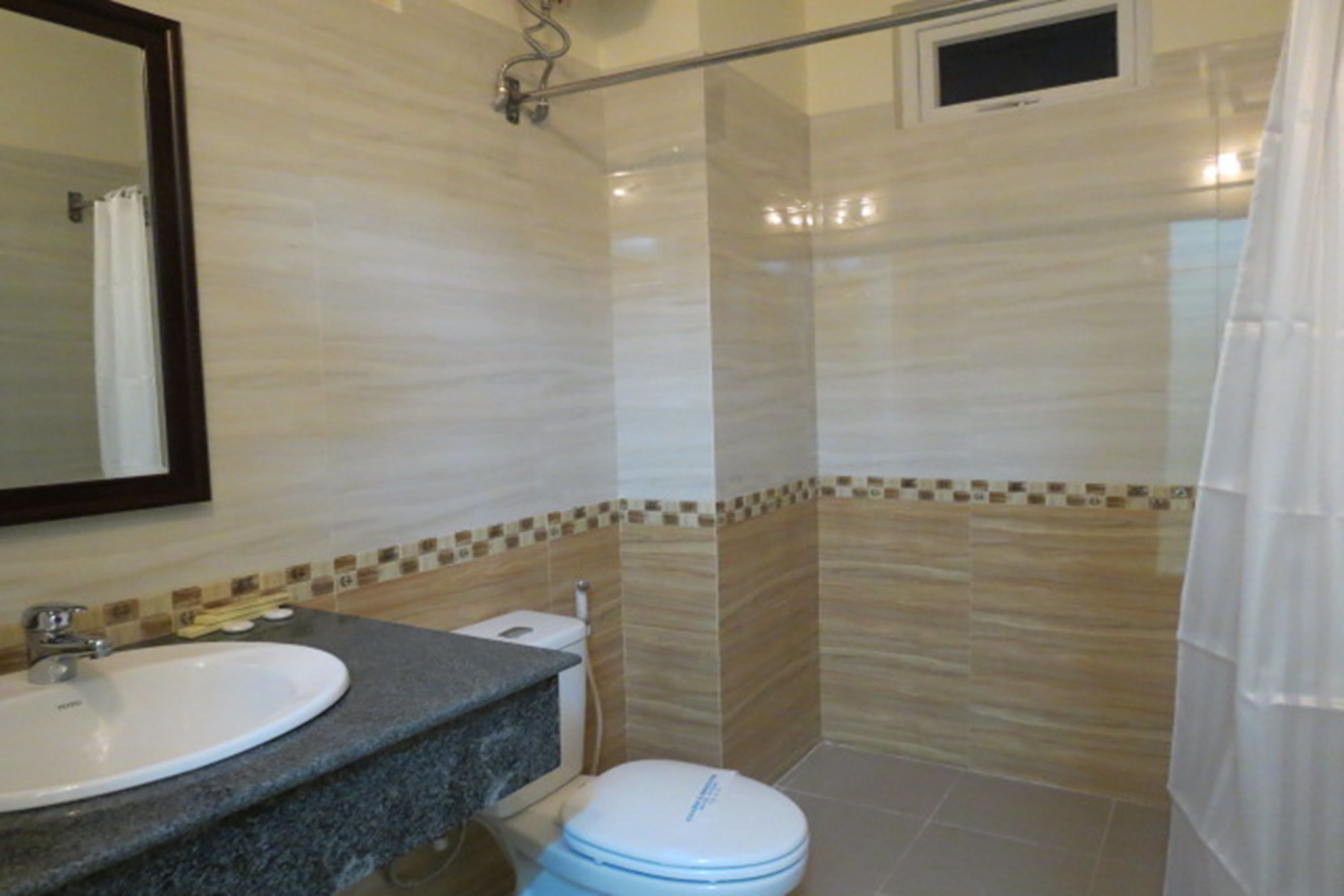 quadruple room | bathroom | shower, free toiletries, hair dryer, slippers