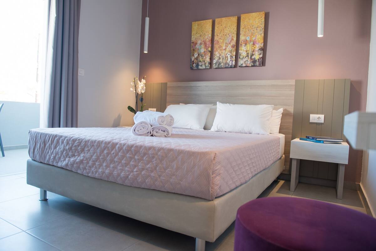 Junior suite, uitzicht op tuin | Italiaanse Frette-lakens, luxe beddengoed, pillowtop-bedden