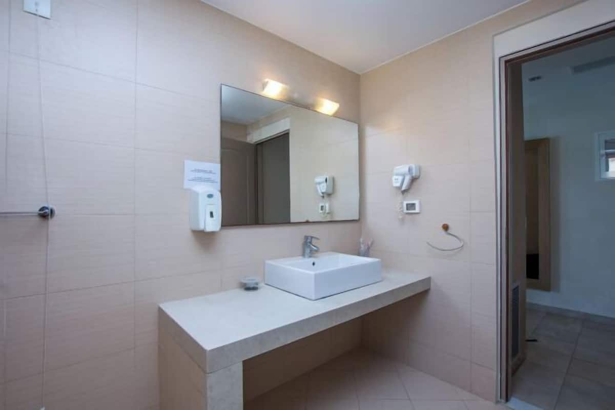 Bathroom | Shower, free toiletries, hair dryer, slippers