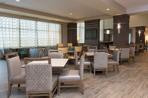 Relax in a spacious lobby with comfortable seating and modern decor.