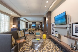 Relax in our spacious lobby with comfortable seating, a large flat-screen TV, and decorative touches.