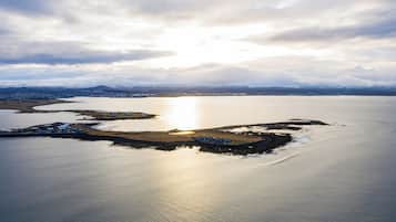 Overlooking a serene lake or sea, this coastal area offers breathtaking views of the surrounding landscape.