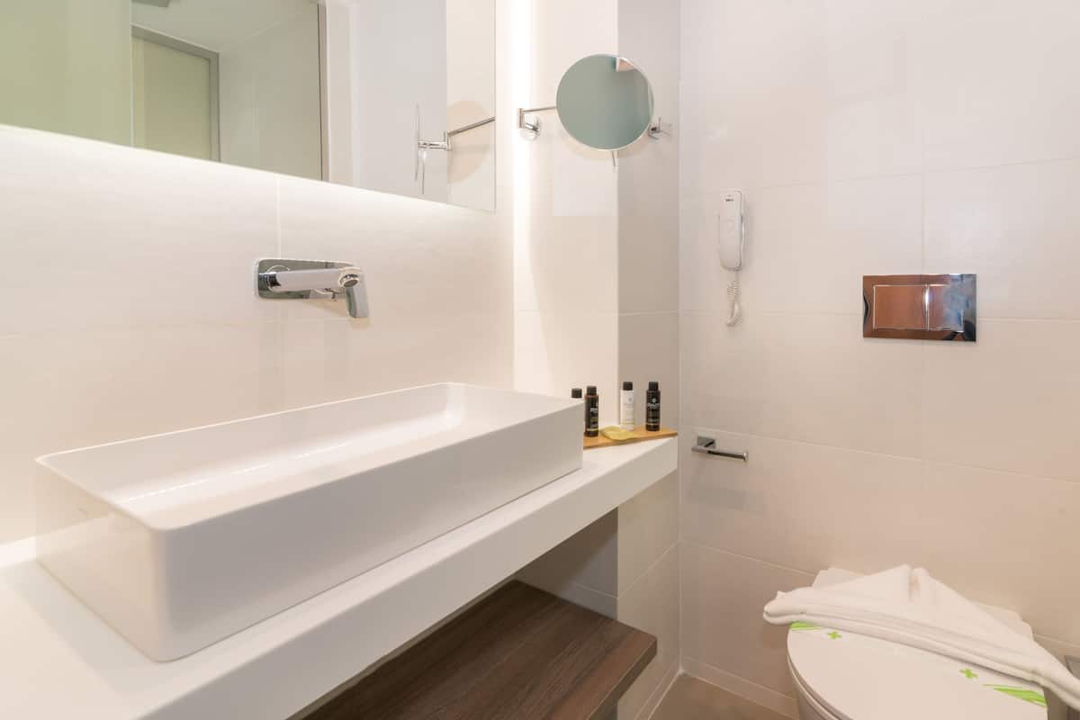 standard room, pool view | bathroom | shower, rainfall showerhead, free toiletries, hair dryer