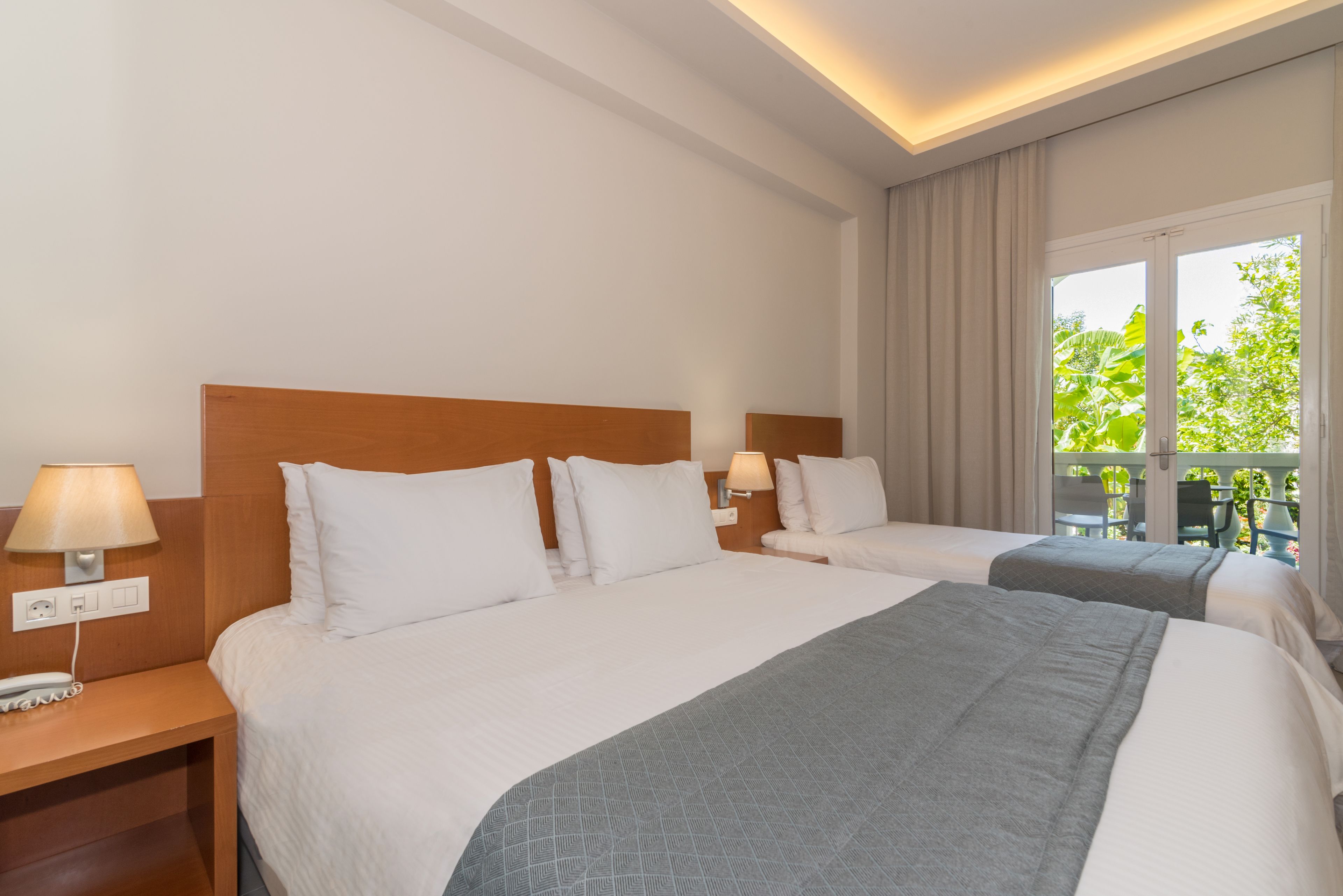 triple room, garden view | 1 bedroom, premium bedding, pillow-top beds, in-room safe
