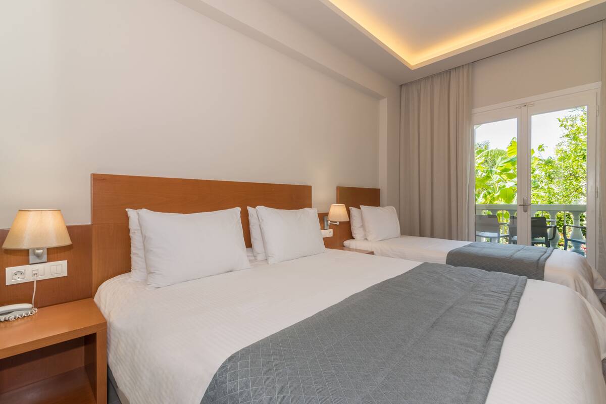 triple room, garden view | 1 bedroom, premium bedding, pillow-top beds, in-room safe