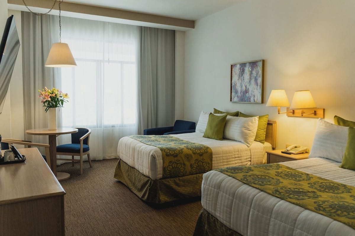 Premium bedding, down comforters, pillowtop beds, in-room safe
