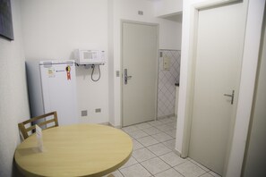 Full-sized fridge, microwave, cookware/dishes/utensils