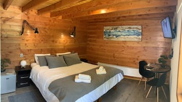 King Suites | Premium bedding, pillow-top beds, blackout curtains, soundproofing