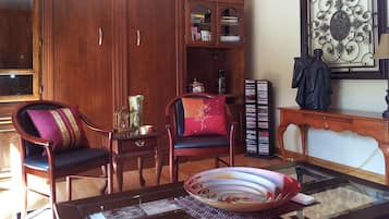Premium Suite, 1 Queen Bed, Jetted Tub, Garden View (The West Wing Suite) | Living area | 50-inch flat-screen TV with satellite channels, TV, fireplace