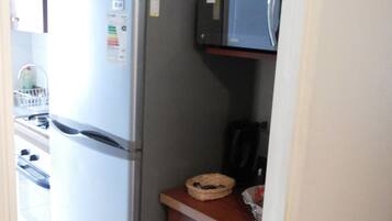 Apartment, 2 Bedrooms | Private kitchen | Full-sized fridge, microwave, stovetop, coffee/tea maker