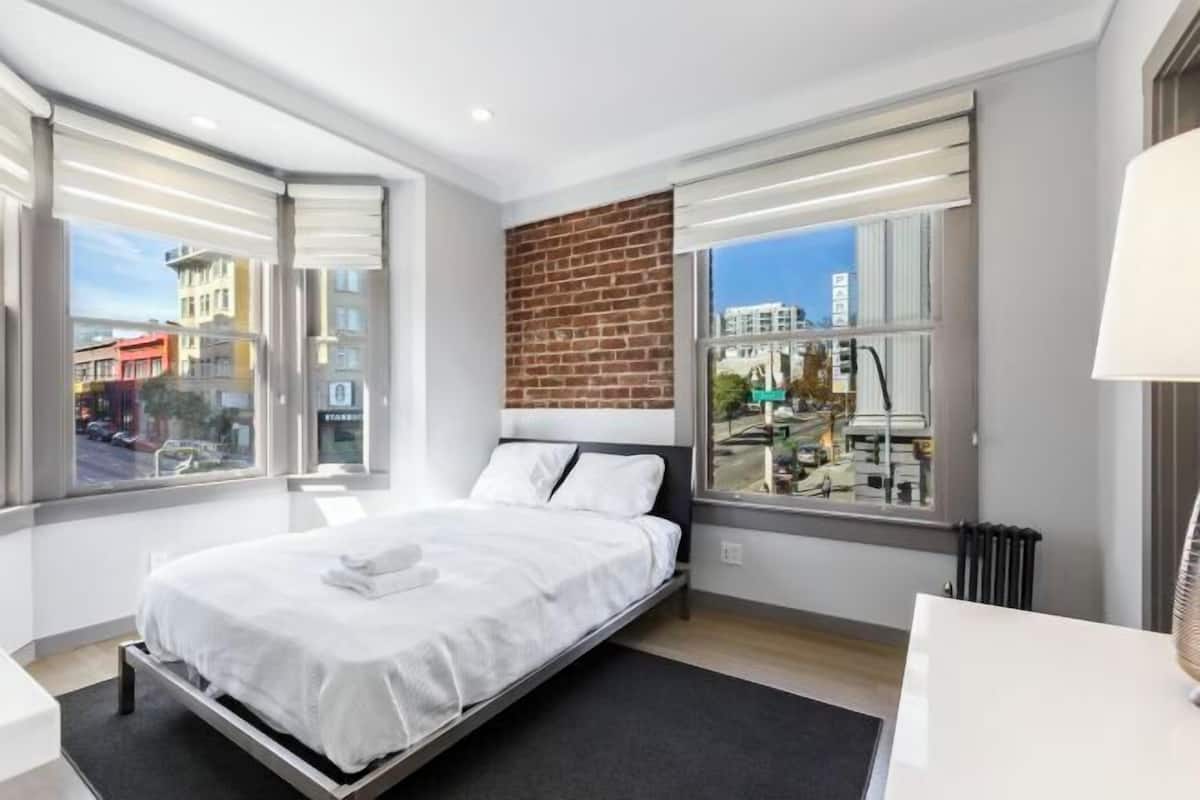 Premium bedding, desk, laptop workspace, free WiFi