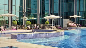 Outdoor pool, open 6:00 AM to 10:00 PM, pool umbrellas, pool loungers