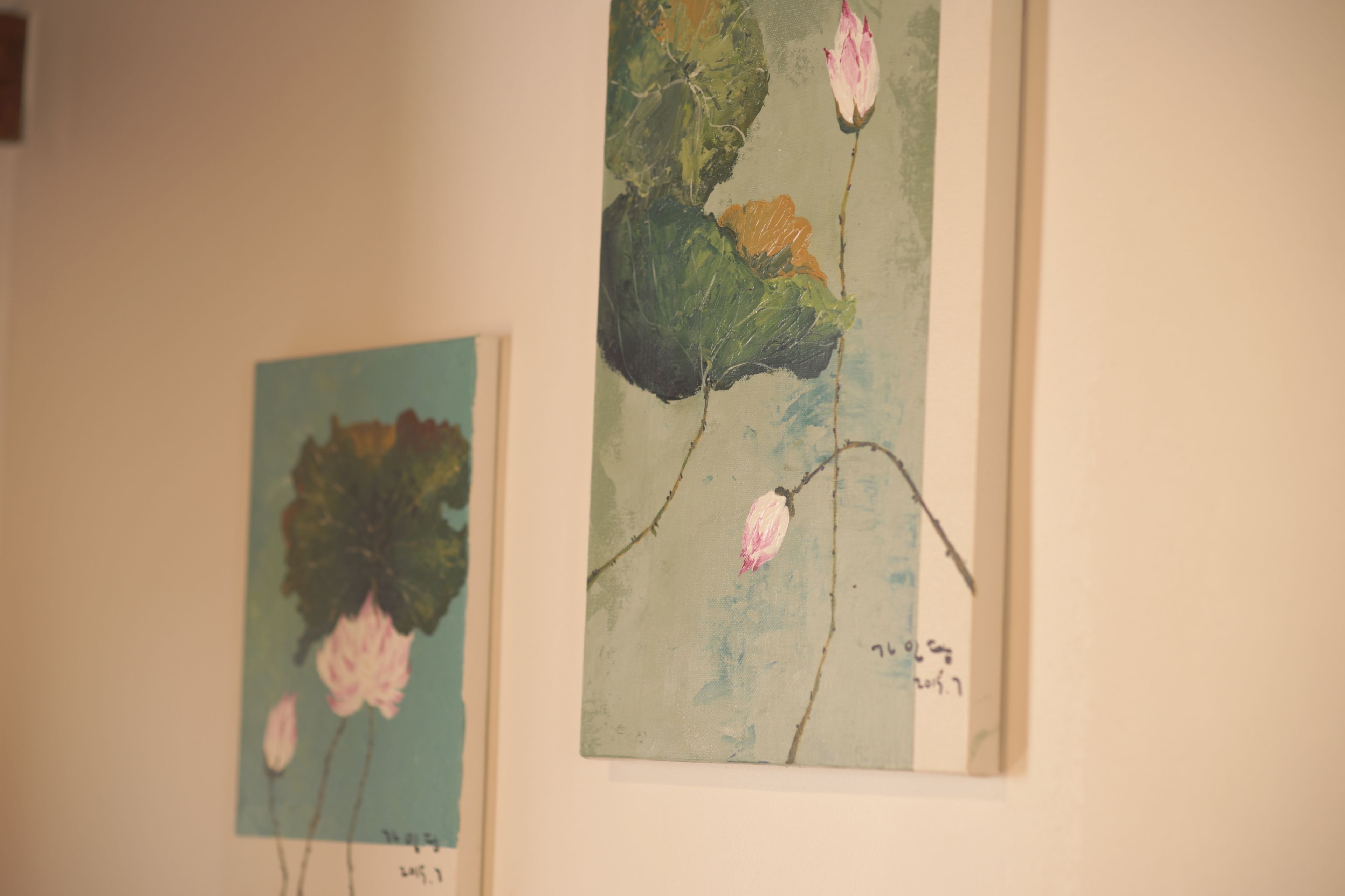 Two paintings on a wall.