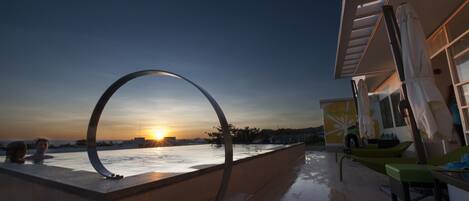 Outdoor pool, open 8:00 AM to 10:00 PM, pool umbrellas, pool loungers