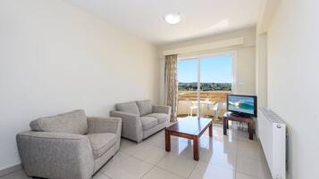 Apartment, 1 Bedroom | Living area | 0-inch flat-screen TV with digital channels, TV