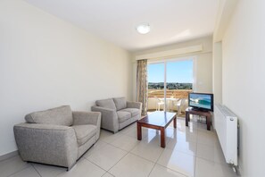 Apartment, 1 Bedroom | Living area | 0-inch flat-screen TV with digital channels, TV