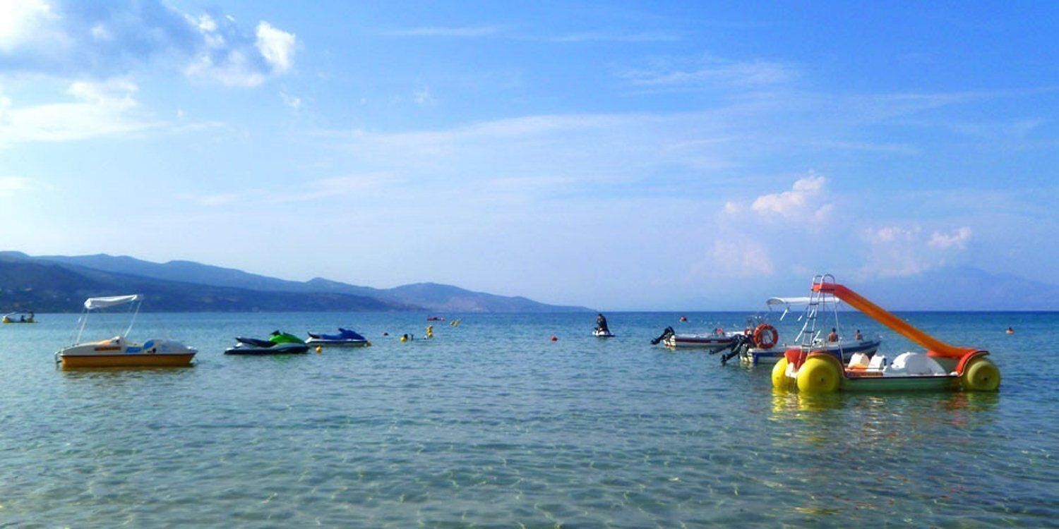 on the beach, sun-loungers, beach umbrellas, beach bar