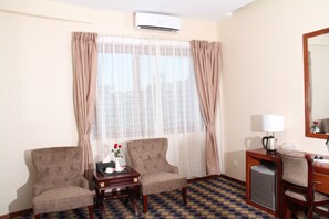 Standard Room | Living area | 40-inch LED TV with satellite channels, TV - Sky Man Hotel (Yangon)