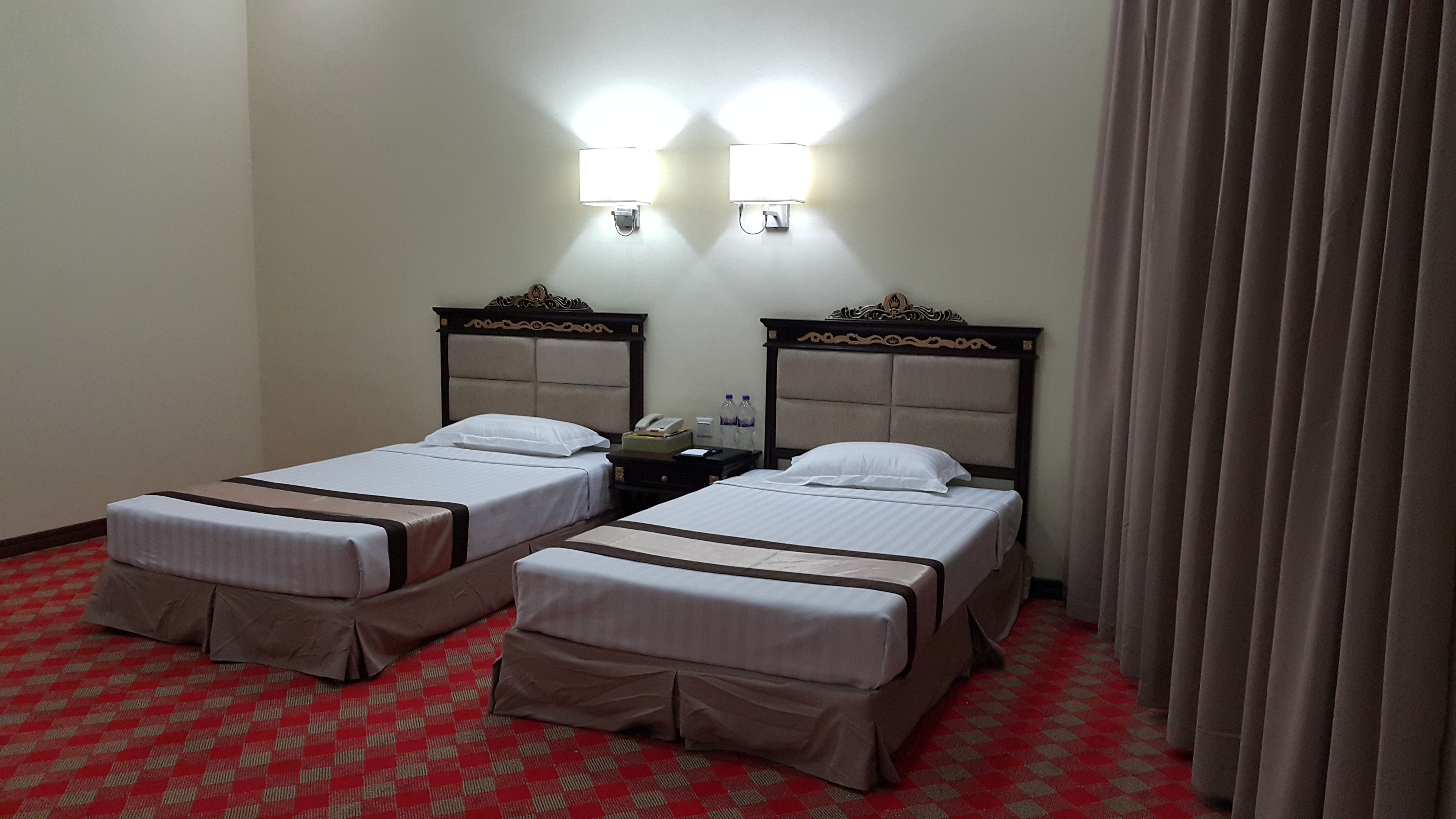 deluxe room | minibar, in-room safe, desk, blackout curtains