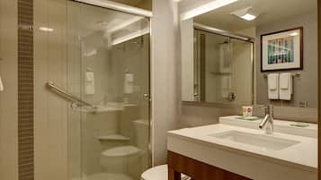 Combined shower/bathtub, designer toiletries, hair dryer, towels