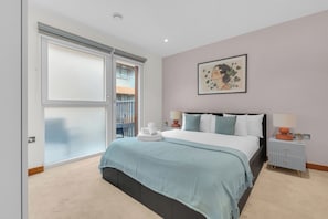 Deluxe Apartment, 1 Bedroom, Private Bathroom, City View | Desk, iron/ironing board, cots/infant beds, rollaway beds