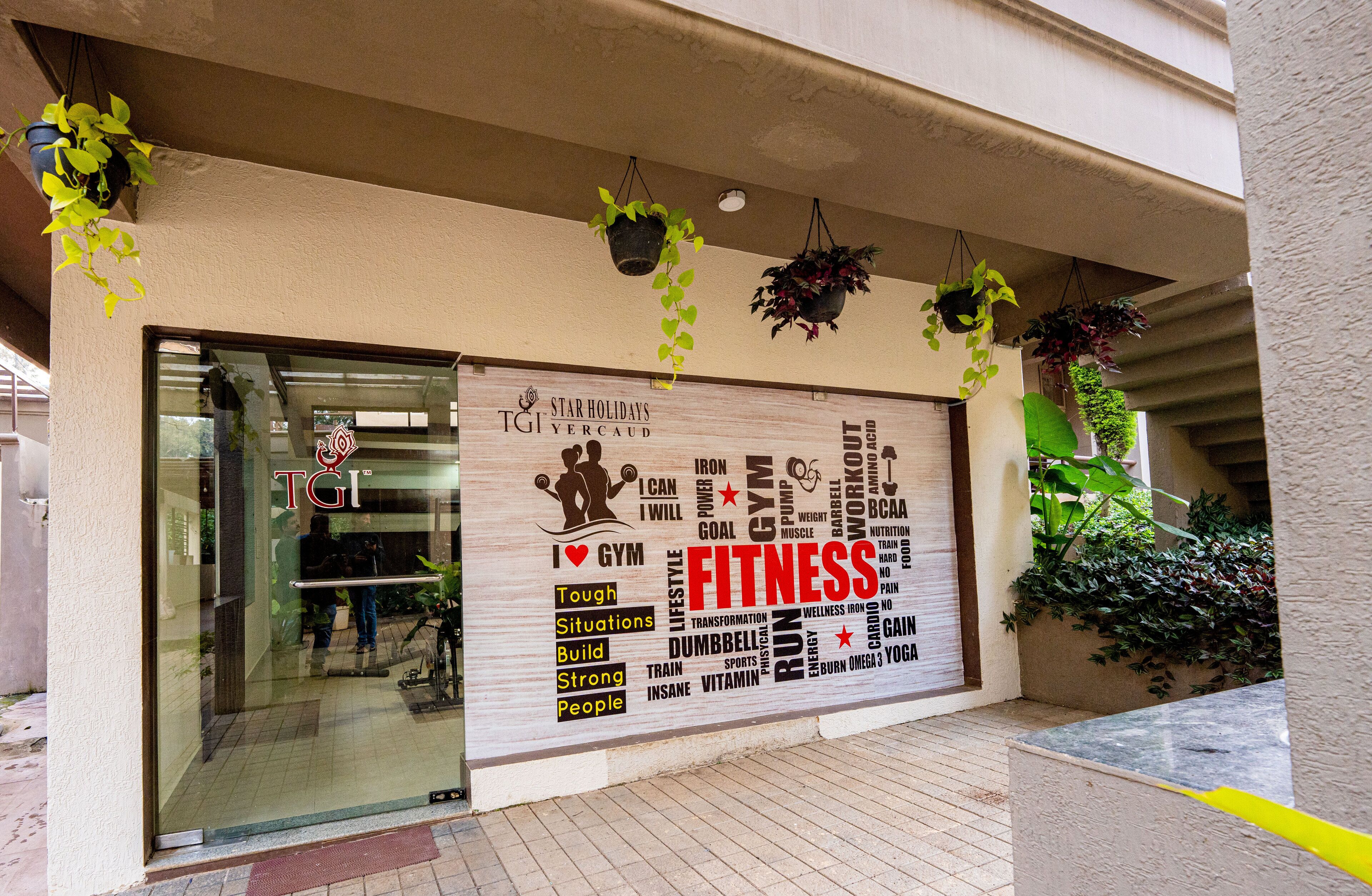 A storefront with a large sign advertising fitness.