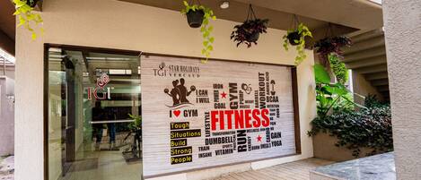 A storefront with a large sign advertising fitness.
