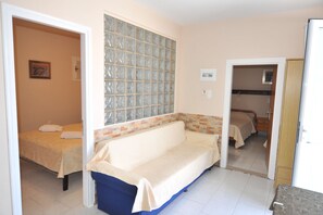 Family Apartment, 2 Bedrooms | Living room | 32-inch flat-screen TV with digital channels, LED TV - Irene Studios (Kos)