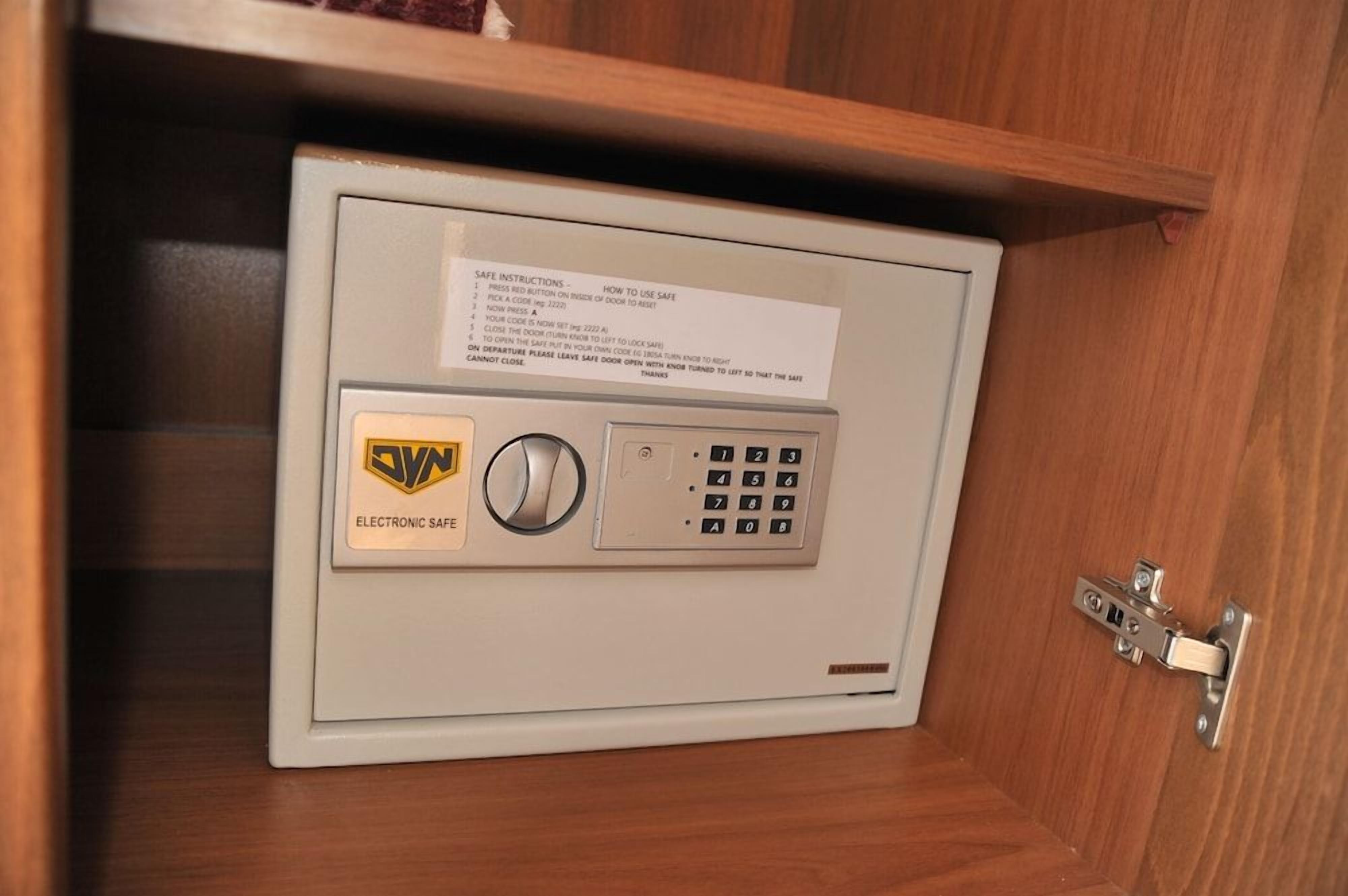 A safe deposit box with a keypad and a lock.
