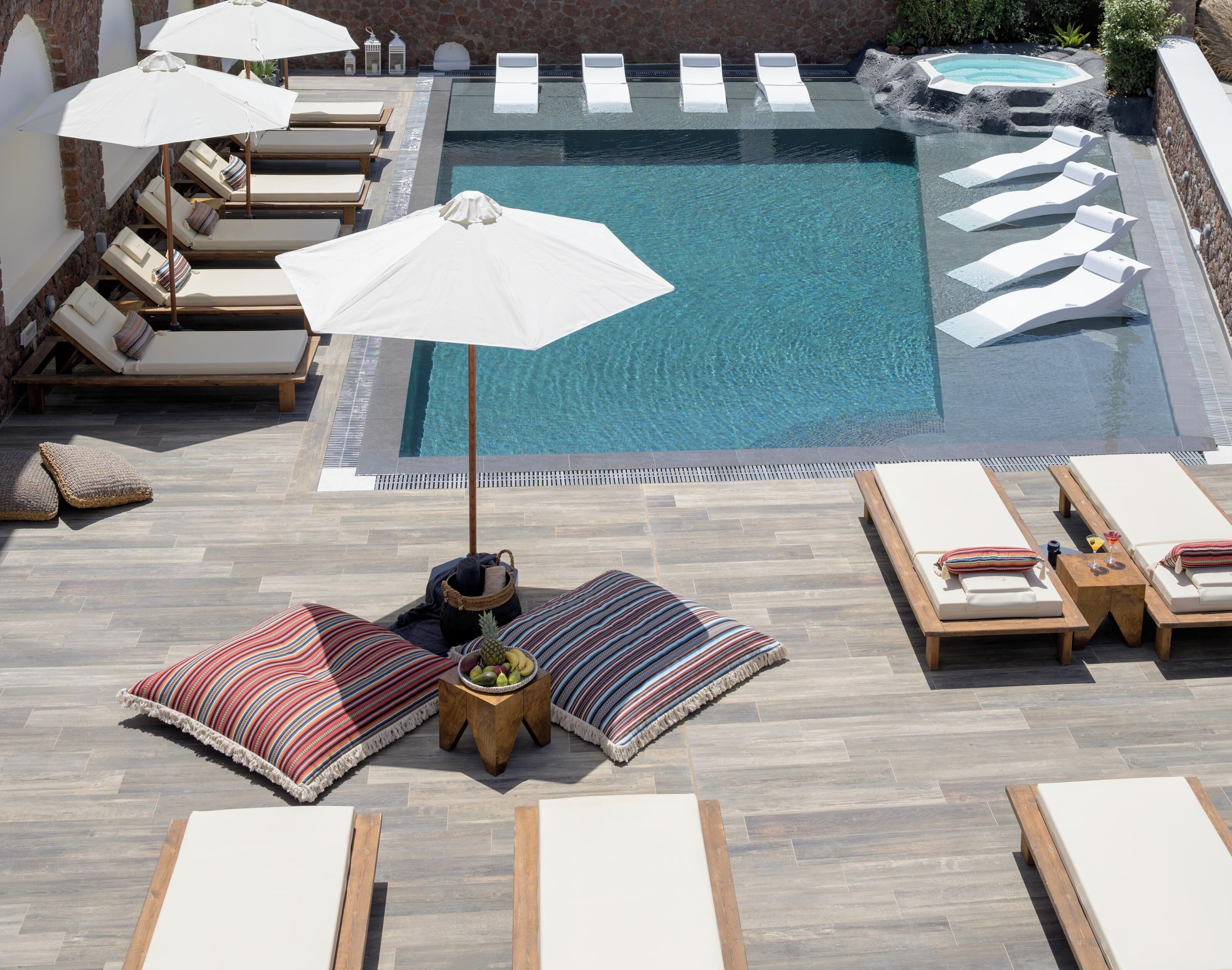 seasonal outdoor pool, open 8 am to 8 pm, pool umbrellas, pool loungers