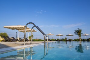 Outdoor pool, open 8:00 AM to 7:00 PM, pool umbrellas, pool loungers