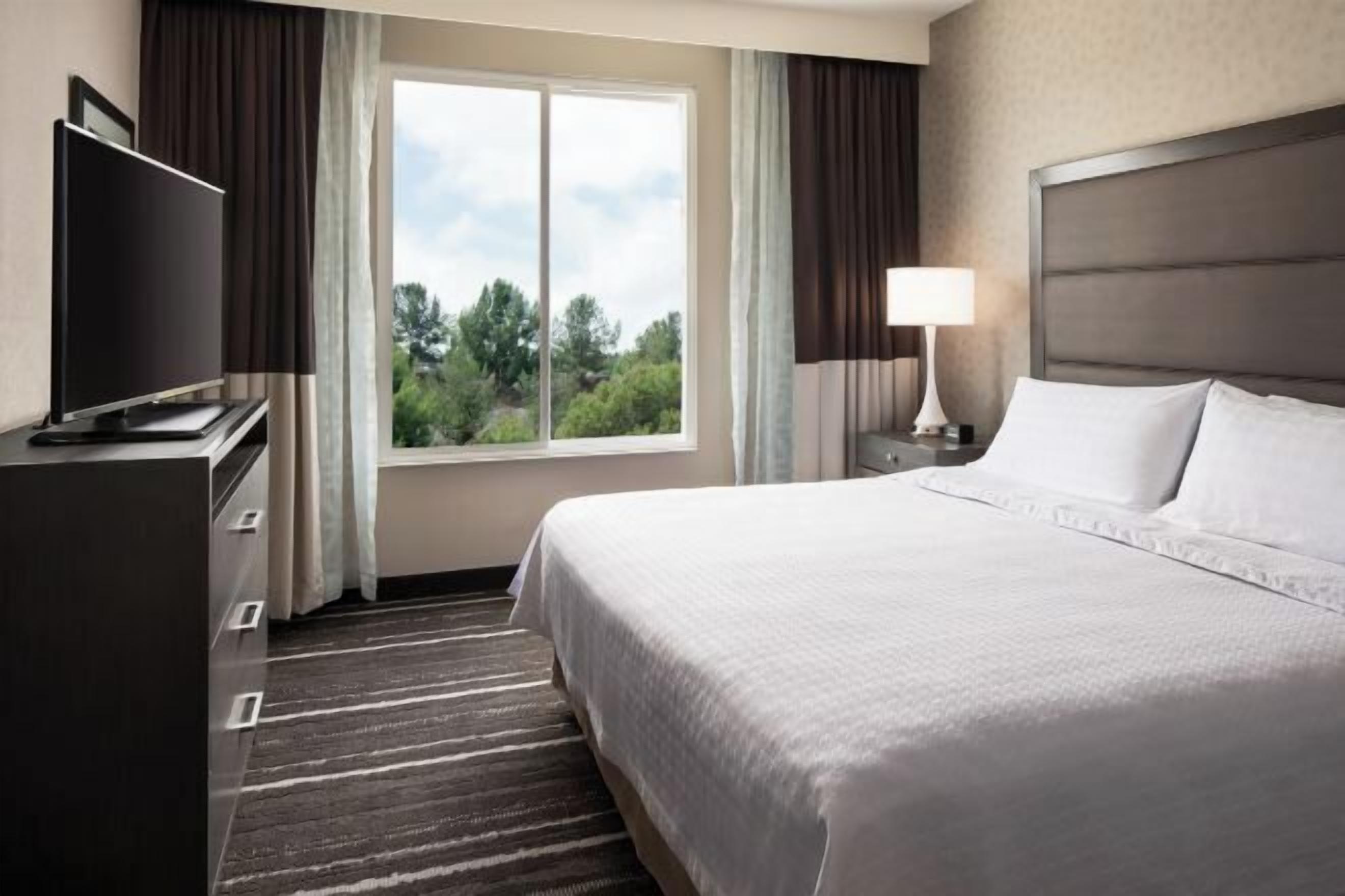 Desk, laptop workspace, blackout drapes, iron/ironing board