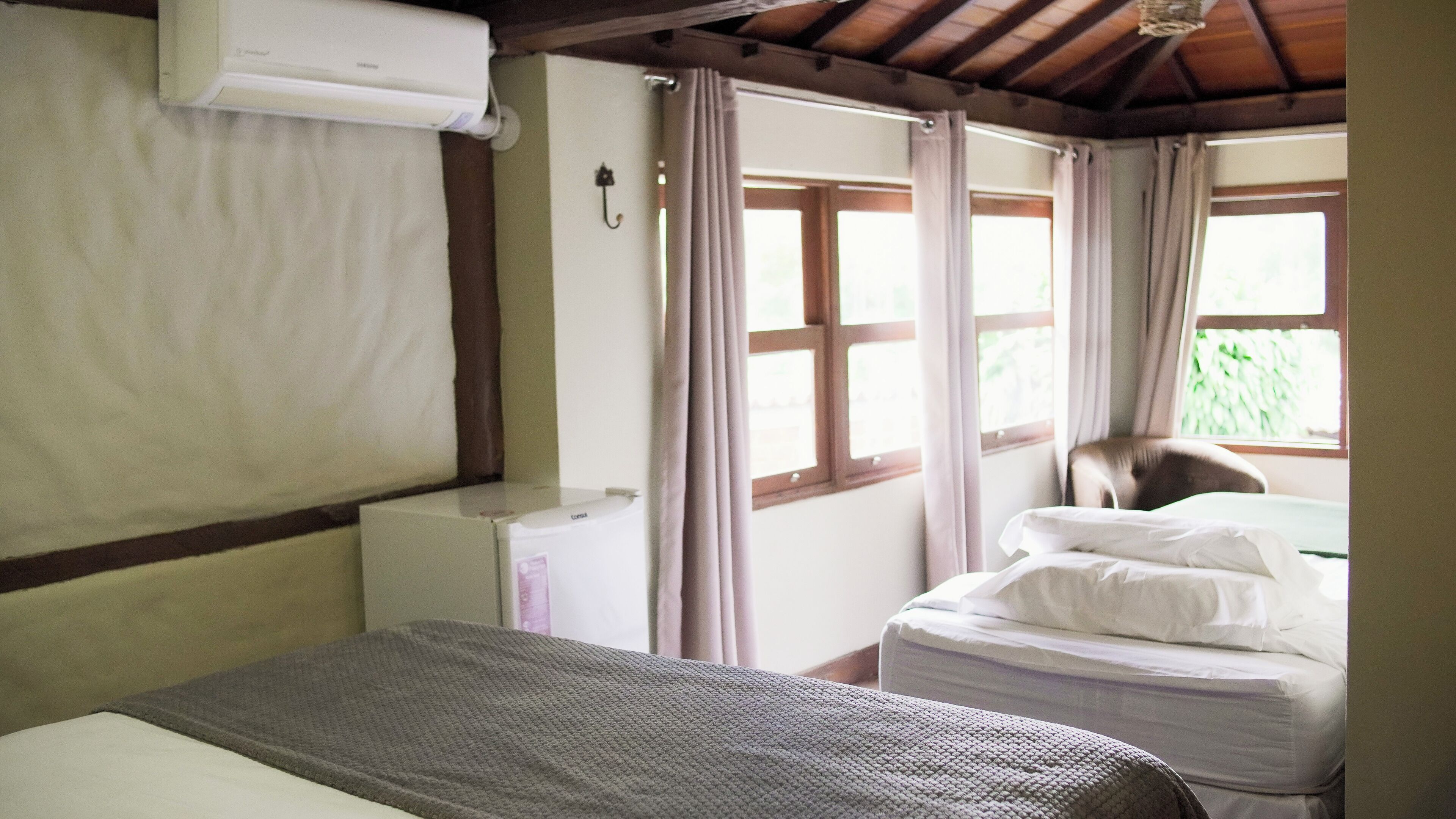 Superior Triple Room, Mountain View | Minibar, blackout drapes, free WiFi, bed sheets