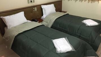 Twin Room | Minibar, in-room safe, desk, blackout drapes