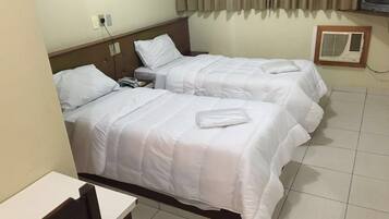 Twin Room | Minibar, in-room safe, desk, blackout drapes