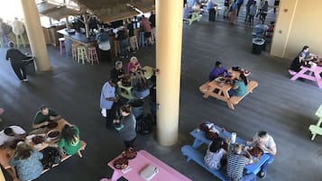 Guests can dine in comfort at this communal space with tables and benches.